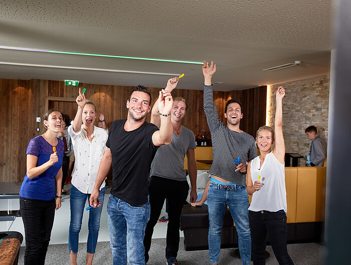 A group enjoys bowling at the Lürzerhof during their active vacation in Austria.
