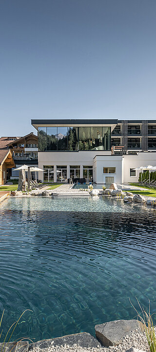 The mountain lake pool at the Lürzerhof wellness hotel in Salzburg