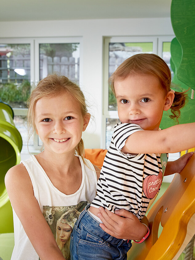 Children play in the play area of the Lürzerhof, the family hotel in Austria for vacations with children.