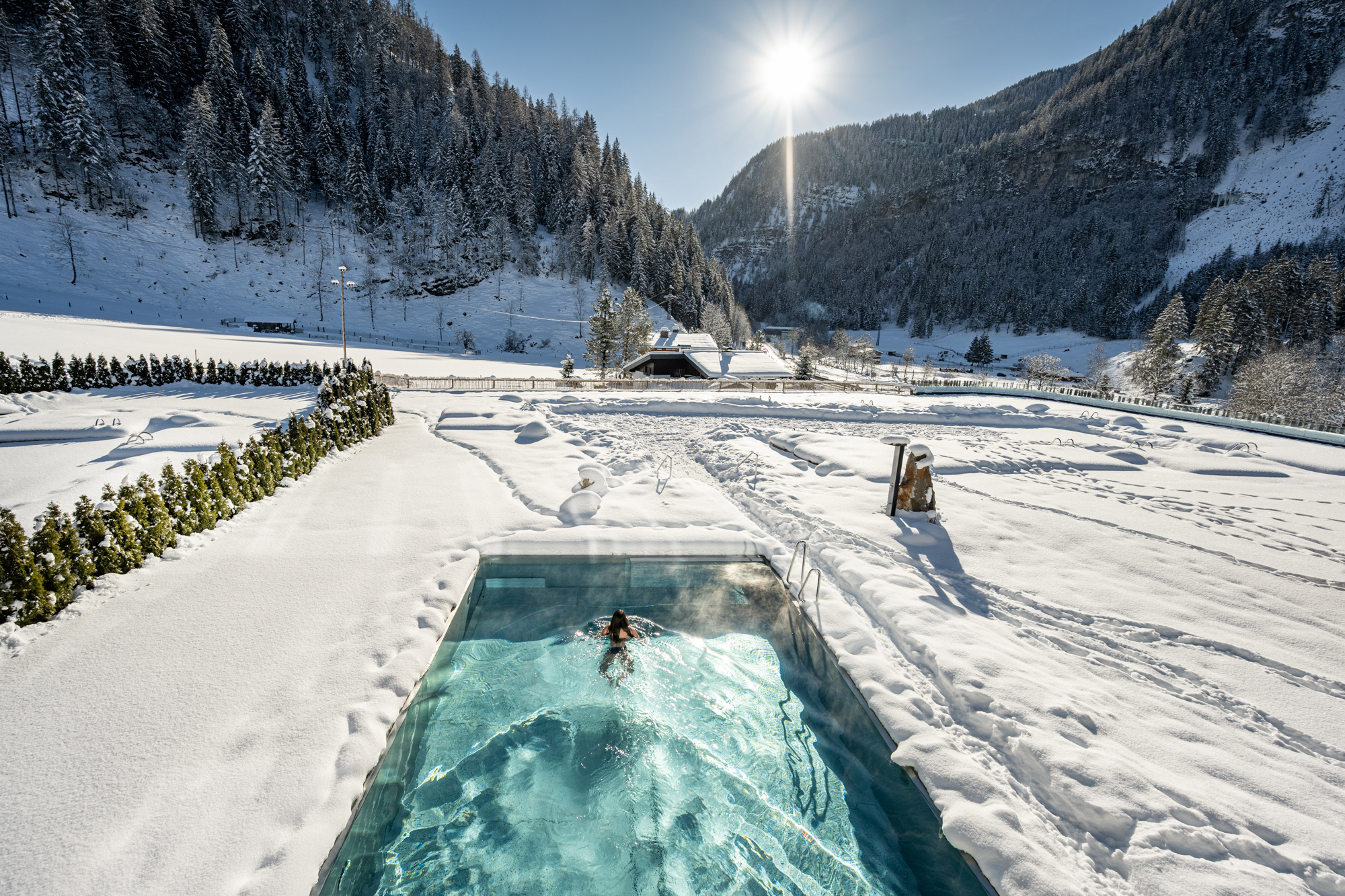 The outdoor pool in winter at the Lürzerhof wellness hotel in Salzburg